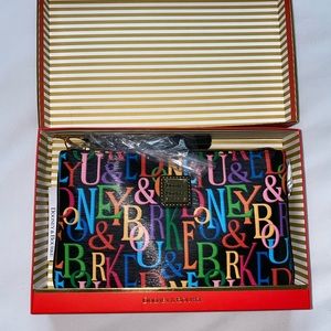 Dooney and Bourke brand new in box, clutch